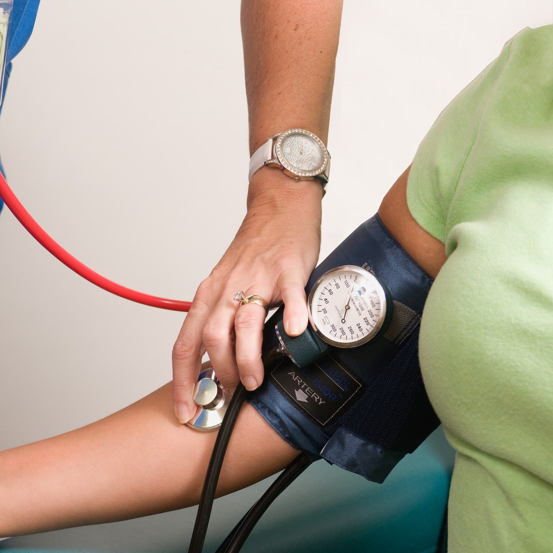 a person with a blood pressure meter on their arm